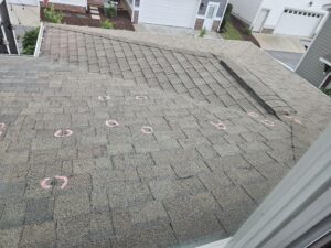 chalk mark spatter on roof from hail damage